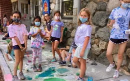 a group of children wearing face masks