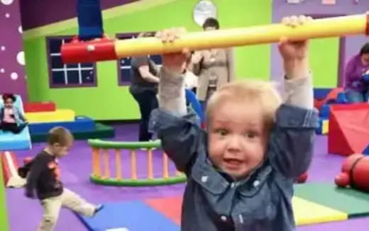 a baby holding a bat