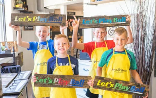 a group of boys wearing yellow shirts