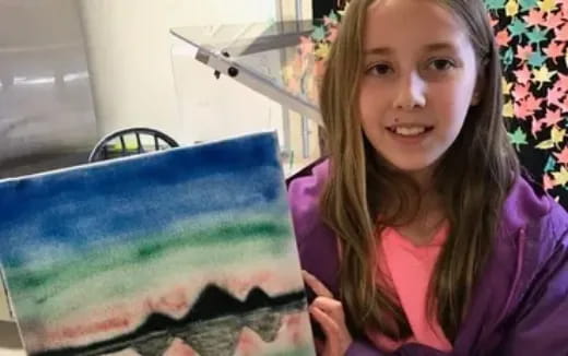 a person holding a blue and white object