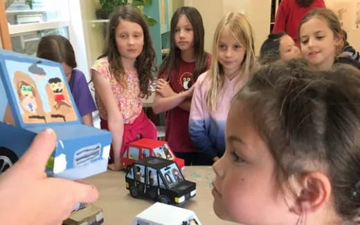 a group of children playing with toys