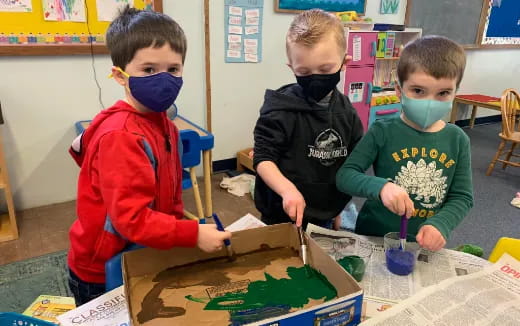 a group of children painting