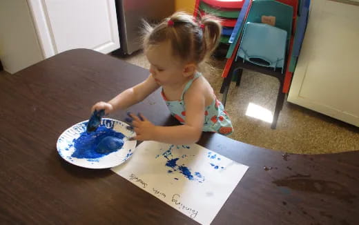 a little girl eating cake