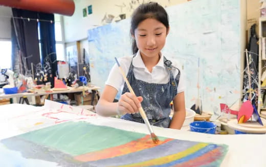 a young girl painting