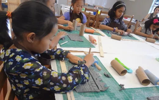 a group of children sitting at a table