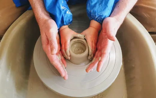 a person washing a sink