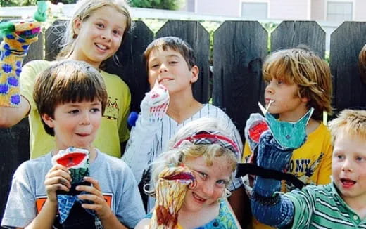 a group of children holding toys