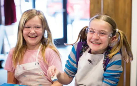 a couple of girls smiling