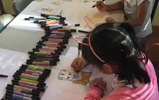 a child sitting at a desk