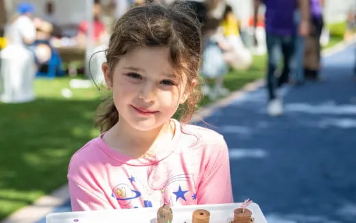 a girl smiling at the camera