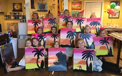 a group of children holding up posters