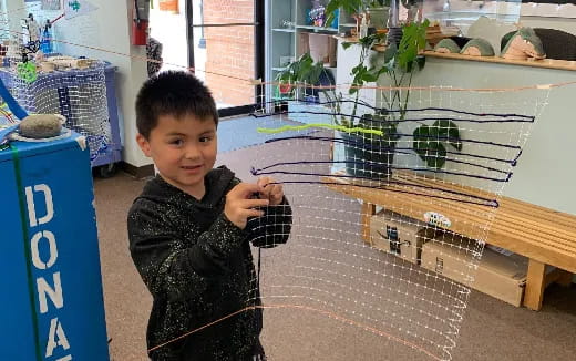 a boy holding a snake