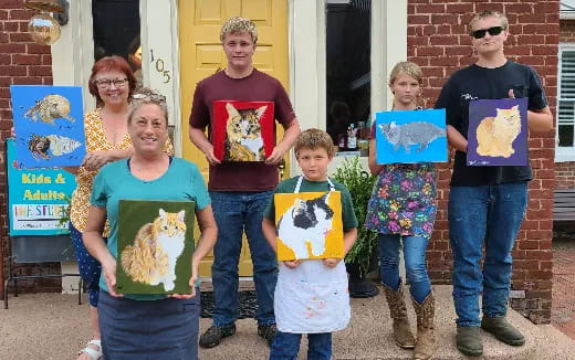 a group of people holding up posters