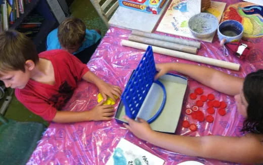 a group of children painting