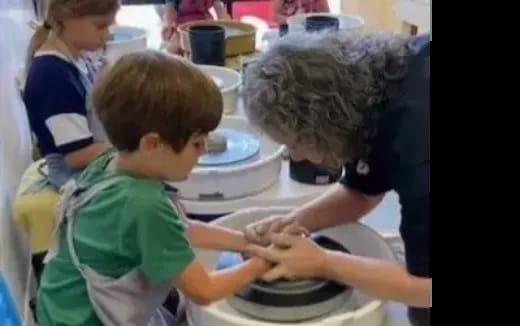 a person and a child playing with water