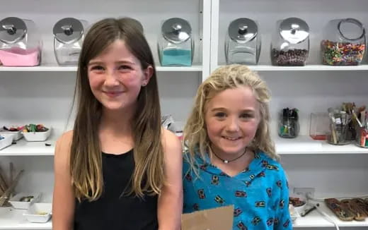 a couple of girls posing for the camera