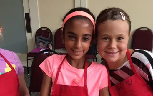 a couple of girls smiling