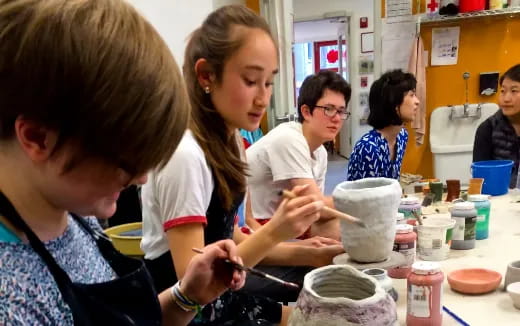 a group of children painting