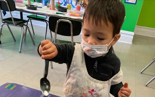 a child with a stethoscope around his neck