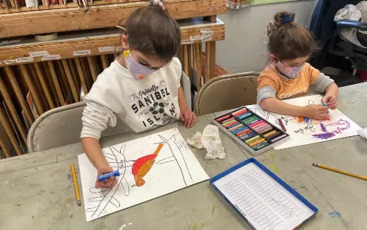 children painting on a table