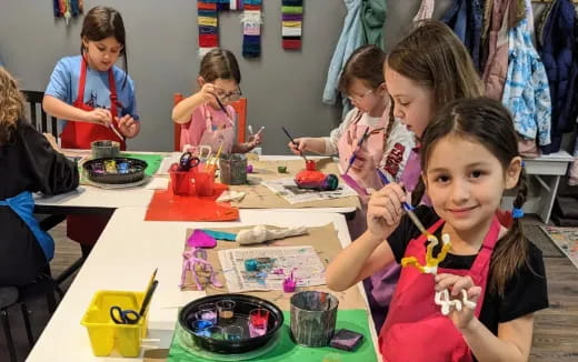 a group of children painting