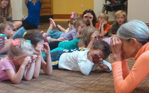 a group of children sitting on the floor
