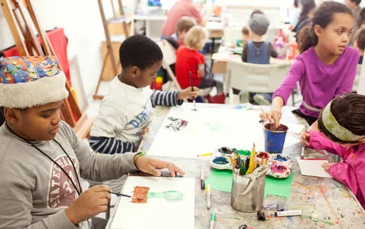 a group of children painting