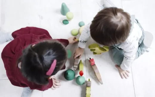 a couple of kids playing with toys