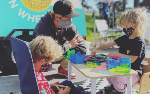 a group of children playing with toys