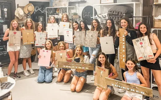 a group of people holding signs
