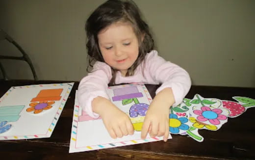 a girl sitting at a table