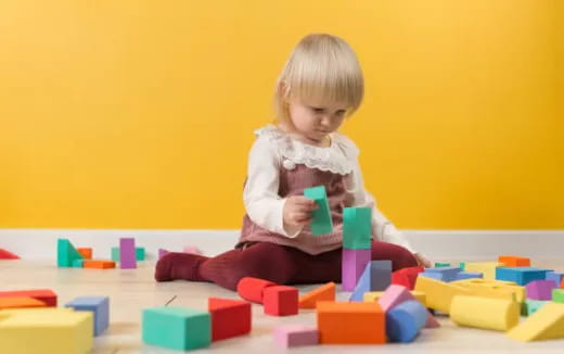 a child playing with blocks