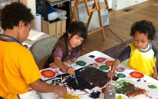 a group of people painting