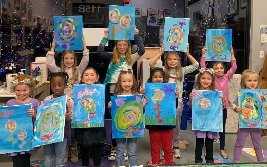 a group of children holding signs