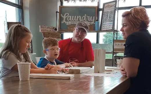 a family sits around a table