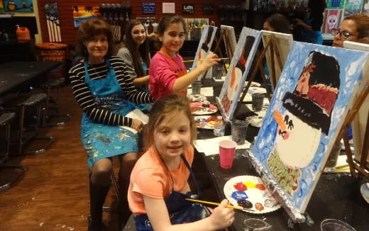a group of children painting