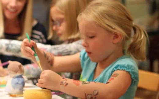 a young girl painting
