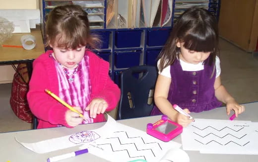 a couple of young girls painting