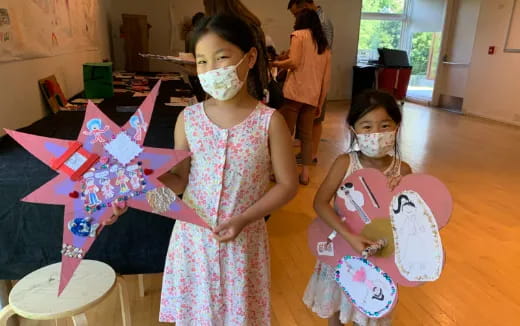 a couple of girls wearing masks