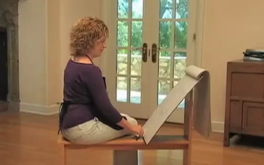 a woman sitting on a chair