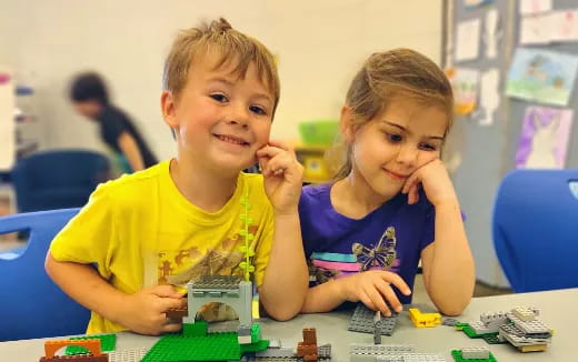 a couple of kids playing a board game