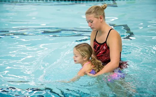 a woman and a child in the water