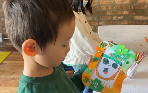 a child painting a cartoon
