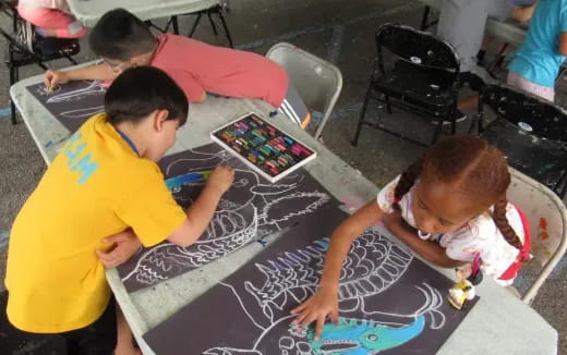 a group of people playing a board game