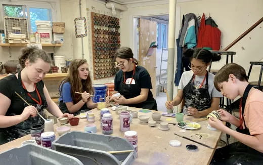 a group of people in a kitchen