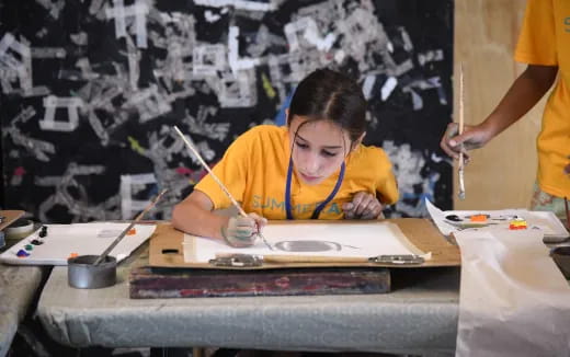 a young girl painting