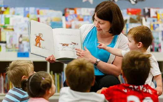 a teacher teaching a group of children
