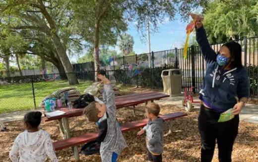a person and children playing outside