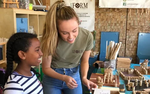 a person and a child playing chess