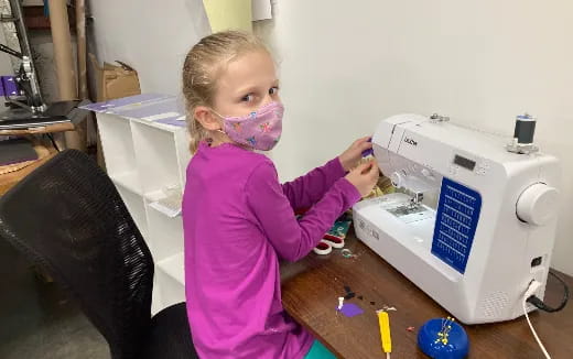 a girl holding a toy
